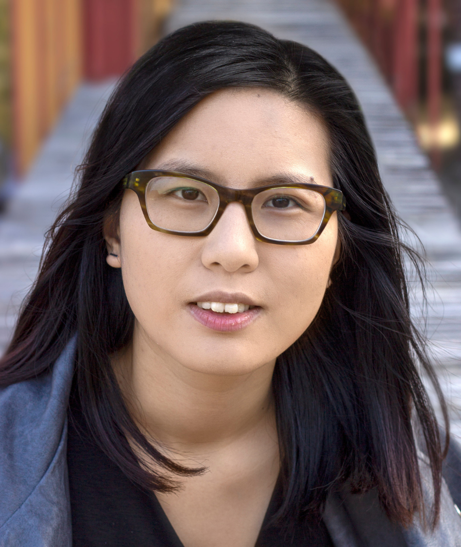 Headshot for Karthy Chin, a young East Asian woman with shoulder-length black hair and glasses.